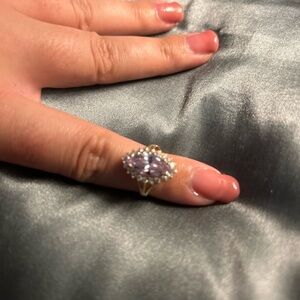 10K solid yellow gold ring with beautiful purple stone and gorgeous “diamonds”